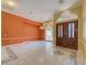 Open living room featuring a chandelier, marble tile, and double doors to front of home at 7333 Royal Oak Dr, Spring Hill, FL 34607