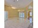 Inviting living room with high ceilings, recessed lighting, and a chandelier that adds a touch of luxury at 7333 Royal Oak Dr, Spring Hill, FL 34607