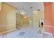 Expansive living area featuring elegant marble floors, decorative lighting, and a seamless open layout at 7333 Royal Oak Dr, Spring Hill, FL 34607