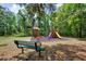 A playground features a bench nearby offering a perfect spot for parents to relax while play and explore at 7333 Royal Oak Dr, Spring Hill, FL 34607