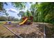 The community playground has multiple slides, swings, and rocking toys, perfect for active play at 7333 Royal Oak Dr, Spring Hill, FL 34607