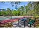 Community tennis courts offer a place to relax and play while enjoying the surrounding scenery at 7333 Royal Oak Dr, Spring Hill, FL 34607