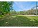 Community tennis and basketball courts provide recreational opportunities amidst lush greenery at 7333 Royal Oak Dr, Spring Hill, FL 34607