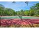 Community tennis courts provide a perfect spot for outdoor recreation, surrounded by lush greenery at 7333 Royal Oak Dr, Spring Hill, FL 34607