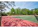 Tennis courts offer a great place to play, surrounded by trees and beautiful landscaping at 7333 Royal Oak Dr, Spring Hill, FL 34607