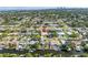 Aerial view showcasing a home within a waterfront community, surrounded by lush greenery at 742 45Th Ne Ave, St Petersburg, FL 33703
