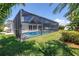 Beautiful view of the home's screened-in pool and patio area, showcasing outdoor living at its best at 742 45Th Ne Ave, St Petersburg, FL 33703