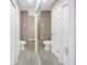Bright bathroom with a large mirror reflecting the matching sink/toilet pairs at 742 45Th Ne Ave, St Petersburg, FL 33703