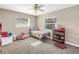 Cozy bedroom with carpet flooring, two windows, and a ceiling fan at 742 45Th Ne Ave, St Petersburg, FL 33703