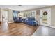 Bright living room featuring hardwood-style floors and a stylish entrance door at 742 45Th Ne Ave, St Petersburg, FL 33703