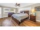 Large main bedroom featuring wood floors, a ceiling fan, and lots of natural light at 742 45Th Ne Ave, St Petersburg, FL 33703
