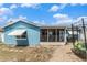 Exterior view of home and enclosed patio with backyard featuring a trampoline at 7426 Cay Dr, Port Richey, FL 34668