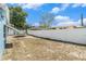 Large backyard with a white fence and ample space for outdoor activities and relaxation at 7426 Cay Dr, Port Richey, FL 34668