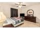 Bedroom featuring a comfortable bed, wood dresser and carpeted floors at 7426 Cay Dr, Port Richey, FL 34668