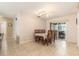 Dining room featuring tile flooring, neutral paint and sliding door to the outside area at 7426 Cay Dr, Port Richey, FL 34668