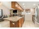 Kitchen with breakfast bar, granite countertops, and stainless steel appliances at 7426 Cay Dr, Port Richey, FL 34668