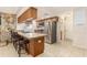 Bright kitchen with stainless steel appliances and breakfast bar seating at 7426 Cay Dr, Port Richey, FL 34668