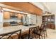 This kitchen features a breakfast bar, stainless steel appliances, and ample counter space for cooking prep at 7426 Cay Dr, Port Richey, FL 34668