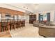 An open-concept layout with a kitchen breakfast bar, and cozy living room with backyard access at 7426 Cay Dr, Port Richey, FL 34668
