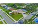 An aerial view displays the property's fenced yard, landscaping, and neighborhood surroundings at 8210 68Th N Way, Pinellas Park, FL 33781