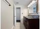 Bathroom featuring a granite countertop vanity, decorative backsplash and tile flooring at 8210 68Th N Way, Pinellas Park, FL 33781