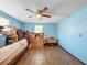 Bedroom featuring wood flooring, a ceiling fan, and good natural lighting at 8210 68Th N Way, Pinellas Park, FL 33781