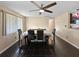 Dining room featuring dark tile flooring, a modern ceiling fan, and room to gather at 8210 68Th N Way, Pinellas Park, FL 33781