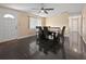 Bright dining room with dark tile flooring, a modern ceiling fan, and room to gather at 8210 68Th N Way, Pinellas Park, FL 33781