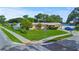 Charming single-story home featuring a well-manicured lawn and mature landscaping at 8210 68Th N Way, Pinellas Park, FL 33781