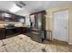 Kitchen with stainless steel appliances and dark cabinets, offering a sleek design at 8210 68Th N Way, Pinellas Park, FL 33781