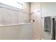 Bright bathroom featuring a tiled shower with glass partition and tiled accents at 8219 Summer Brook Ct, Land O Lakes, FL 34638
