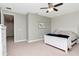 Bright bedroom featuring a white bed set, decorative wall, light-colored furniture, and minimalist decor at 8219 Summer Brook Ct, Land O Lakes, FL 34638