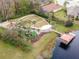 A community park featuring a playground, a gazebo, and a pier on a tranquil lake surrounded by trees at 8219 Summer Brook Ct, Land O Lakes, FL 34638