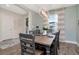 Bright dining room with stylish light fixture, wood table, and decorative accents at 8219 Summer Brook Ct, Land O Lakes, FL 34638