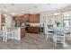 Charming kitchen features wood cabinets, granite countertops, stainless steel appliances, and a lovely eat-in area at 8219 Summer Brook Ct, Land O Lakes, FL 34638