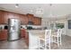 This kitchen features modern appliances, beautiful wood cabinets, and a bright dining area, creating an inviting atmosphere at 8219 Summer Brook Ct, Land O Lakes, FL 34638