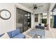 Relaxing outdoor patio with blue furnishings and access to the swimming pool at 8219 Summer Brook Ct, Land O Lakes, FL 34638