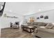 Comfortable living room featuring a large sectional sofa, and modern decor at 8240 Jacaranda Ave, Seminole, FL 33777