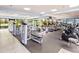 Community gym with modern exercise equipment, weights and bright windows at 11246 Kapok Grand Cir, Madeira Beach, FL 33708