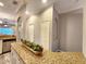 Stylish kitchen island with granite countertop detail and charming succulent centerpiece at 11246 Kapok Grand Cir, Madeira Beach, FL 33708