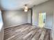 Open-concept living room features modern flooring and light-filled space at 11246 Kapok Grand Cir, Madeira Beach, FL 33708