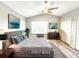 A lovely main bedroom featuring a large bed, stylish decor, and ample natural light at 11246 Kapok Grand Cir, Madeira Beach, FL 33708
