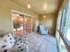 Inviting sunroom provides a relaxing transition between indoors and outdoors at 11246 Kapok Grand Cir, Madeira Beach, FL 33708