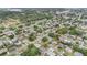 An aerial view of a residential neighborhood, filled with mature trees, neat streets, and various home designs at 11350 112Th Ave, Largo, FL 33778