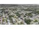 Scenic aerial view of a neighborhood showcasing lush greenery, well-maintained streets, and diverse housing styles at 11350 112Th Ave, Largo, FL 33778