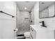Updated bathroom features a modern vanity with dark hardware, a tile shower, and stylish finishes at 11350 112Th Ave, Largo, FL 33778