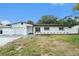 Charming single-story home featuring a well-manicured lawn and a neatly paved driveway at 11350 112Th Ave, Largo, FL 33778