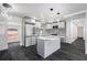 Modern kitchen featuring a center island, sleek appliances, and stylish backsplash at 11350 112Th Ave, Largo, FL 33778