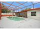 This screened-in pool is surrounded by a spacious deck, perfect for enjoying sunny days at 11350 112Th Ave, Largo, FL 33778