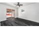 Bright room with dark wood floors and sliding glass doors leading to the outside offers indoor-outdoor living at 11350 112Th Ave, Largo, FL 33778